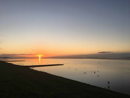 A sunrise above a calm Wadden Sea
