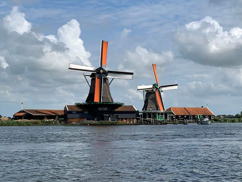 Two adjacent windmills in Zaanse Schans, the best place in The Netherlands to visit a windmill