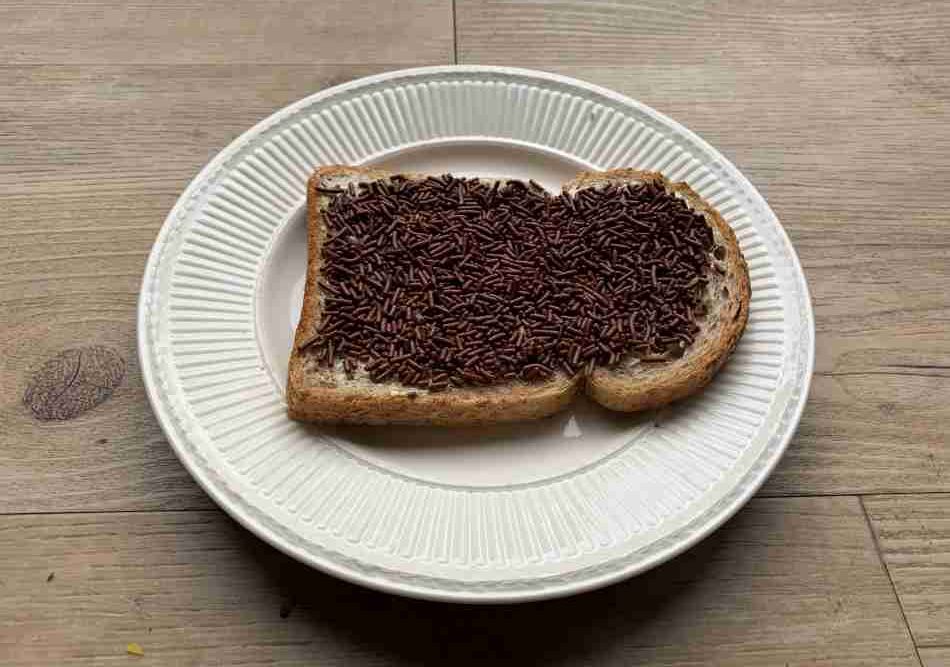 A sandwhich with sprinkles is a traditional Dutch breakfast