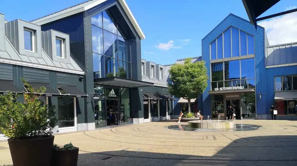 A square with shops in Batavia Stad, the outlet mall in Lelystad in The Netherlands